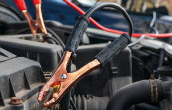 jump cables on car