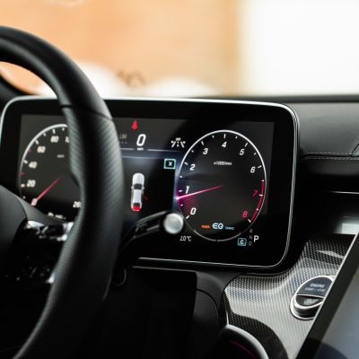 Modern car dashboard with speedometer, tachometer.